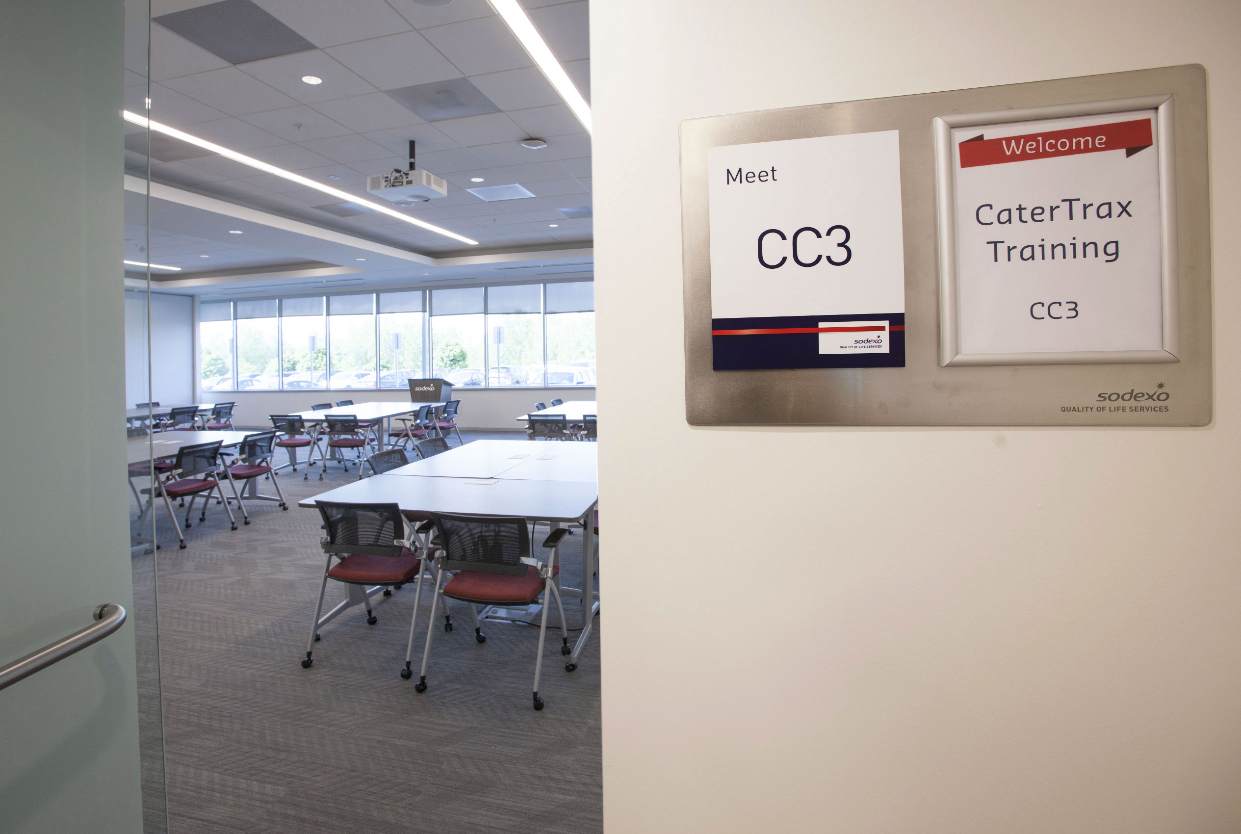 Conference room with stainless steel plaque with Sodexo logo signage