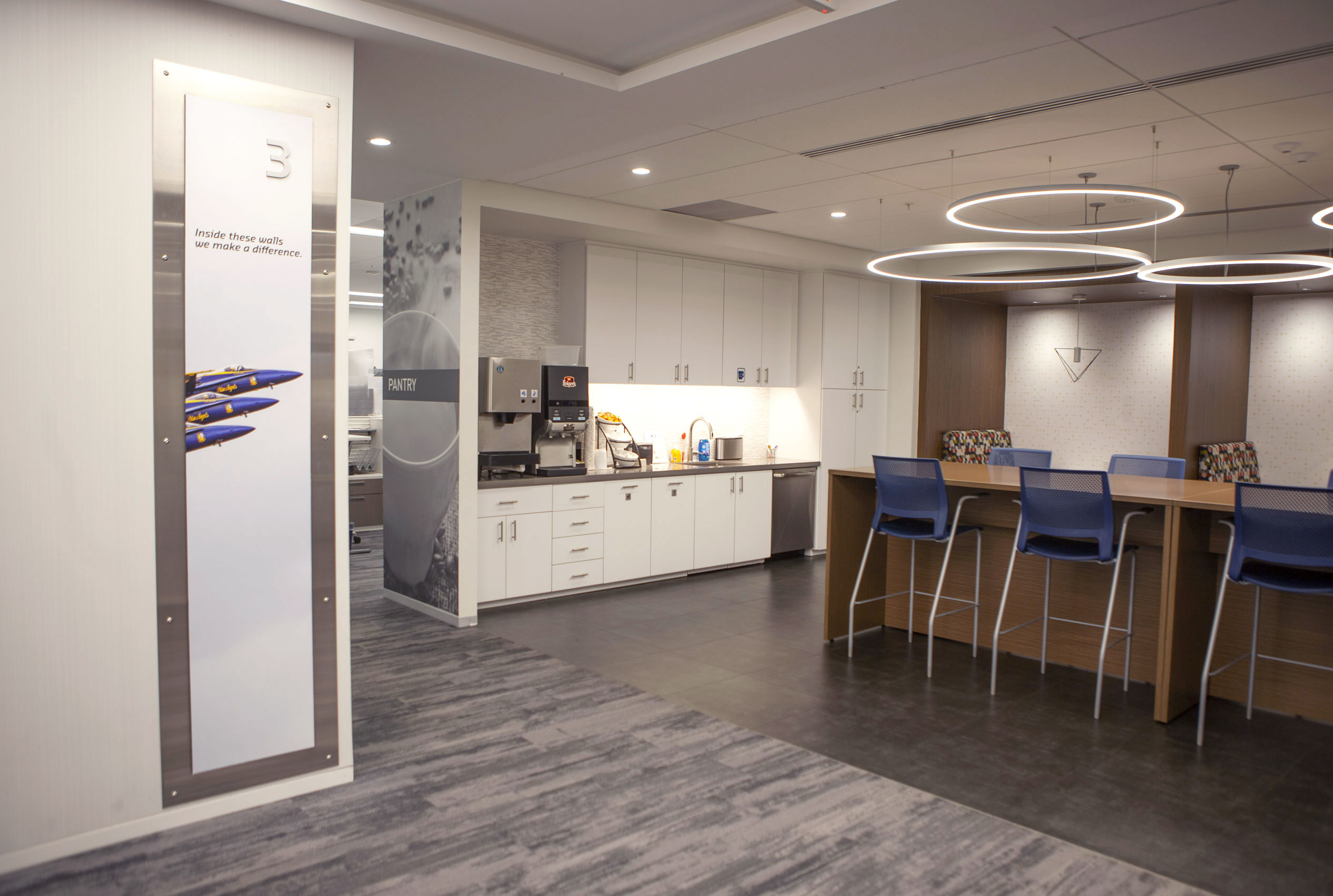 Elevator landing with large photo of Blue Angels airplanes and dining area