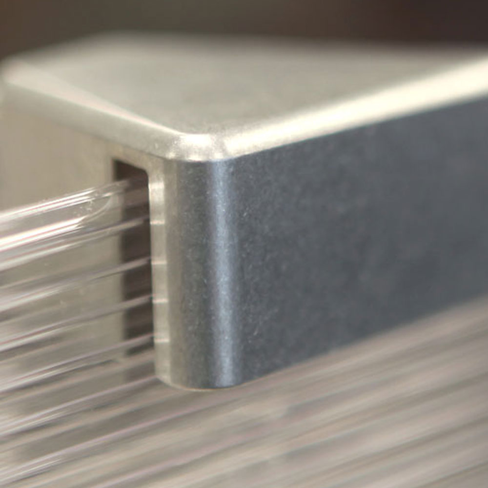 Detail of square aluminum hardware connecting plexiglass panels